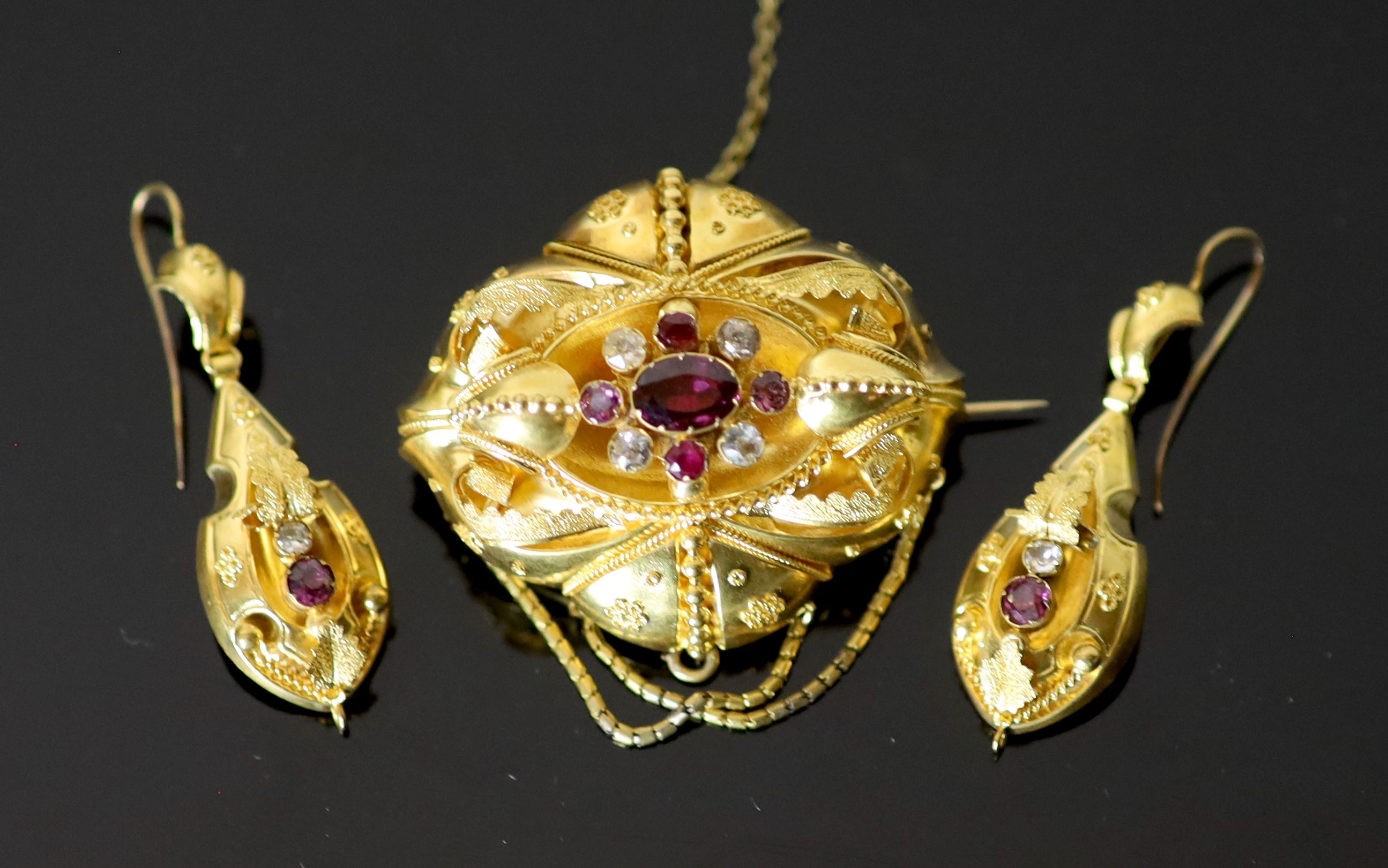 A Victorian 15ct gold, garnet and white stone set demi parure,